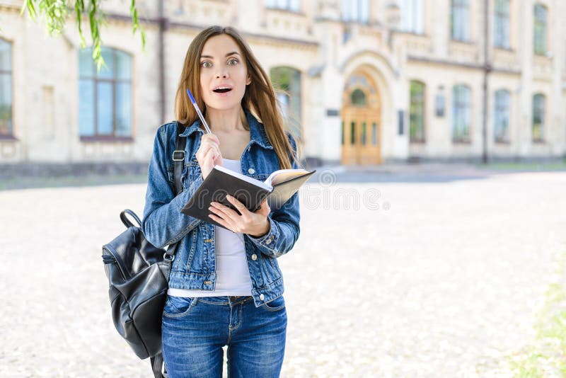 Aha moment! Test answer good emotion novelty people concept. Photo portrait of surprised excited cheerful joyful teenager holding