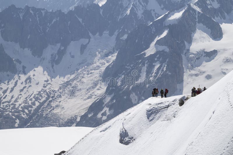 Calm morning view on the Aiguille du Midi - 3,842 m ,mountain in the Mont Blanc massif , French Alps. Calm morning view on the Aiguille du Midi - 3,842 m ,mountain in the Mont Blanc massif , French Alps.