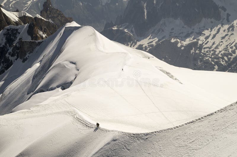 Calm morning view on the Aiguille du Midi - 3,842 m ,mountain in the Mont Blanc massif , French Alps. Calm morning view on the Aiguille du Midi - 3,842 m ,mountain in the Mont Blanc massif , French Alps.