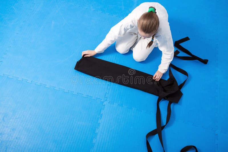 An Aikidoka Girl Folding Her Hakama for Aikido Stock Image - Image of ...