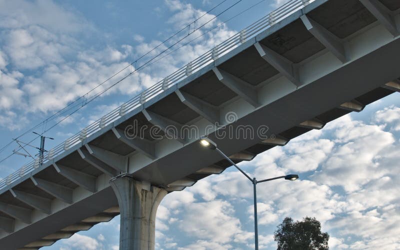 Air bridge and train track with blue sky and clouds. Modern bridge train rail with blue sky and clouds stock images Air bridge and train track with blue sky and clouds. Modern bridge train rail with blue sky and clouds stock images