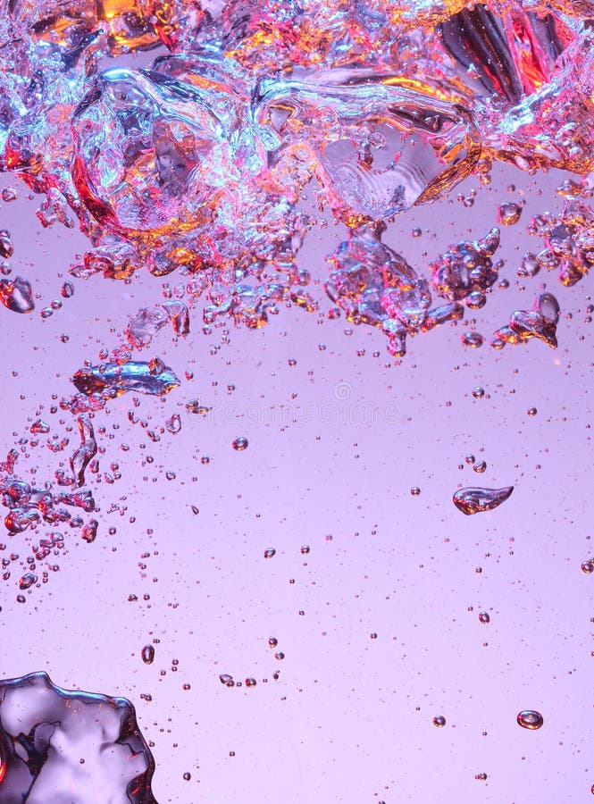 Colorful air bubbles in purple and pink lighted water. Colorful air bubbles in purple and pink lighted water.