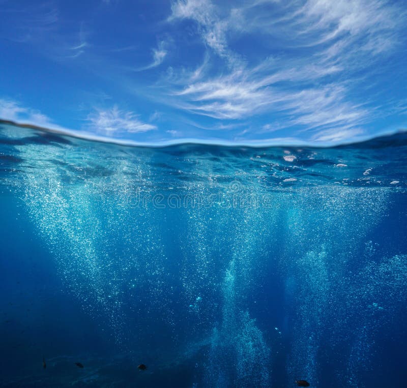 Air bubbles underwater and sky over under water