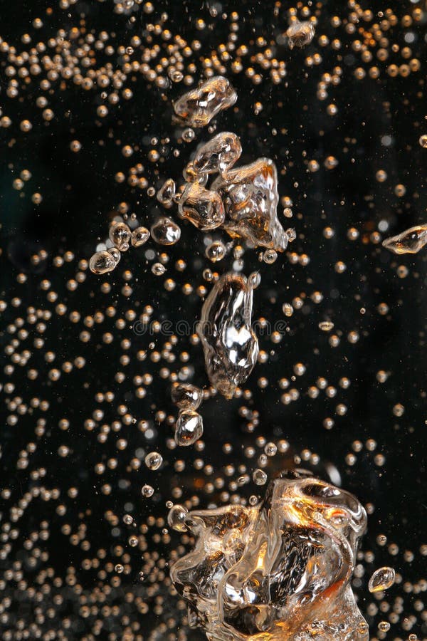 Air bubbles of many sizes and shapes floating in water. Air bubbles of many sizes and shapes floating in water.