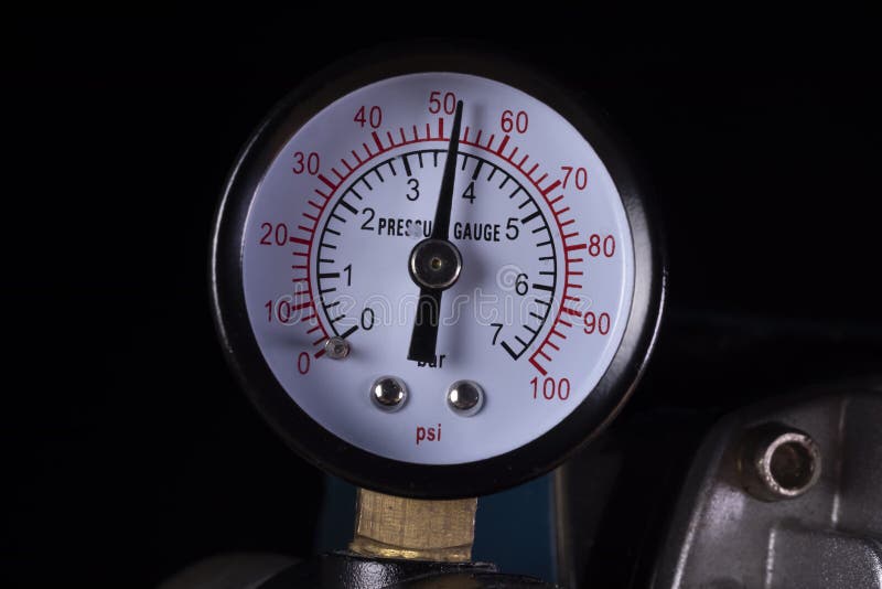 Air compressor manometer close-up. Pressure gauge measurement stock photography