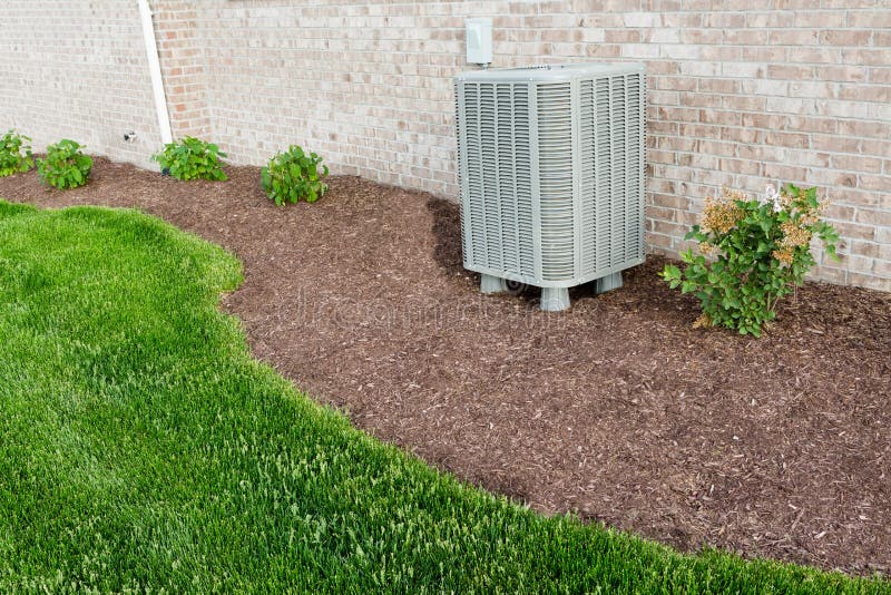 Air conditioner condenser unit standing outdoors royalty free stock photos Air conditioner condenser unit standing outdoors royalty free stock photos