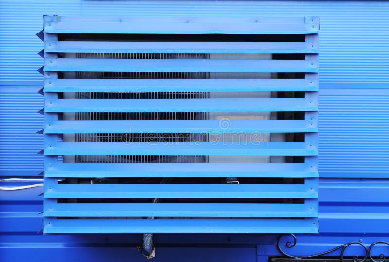 The Air Conditioner Installed on the Street is Protected by a Metal