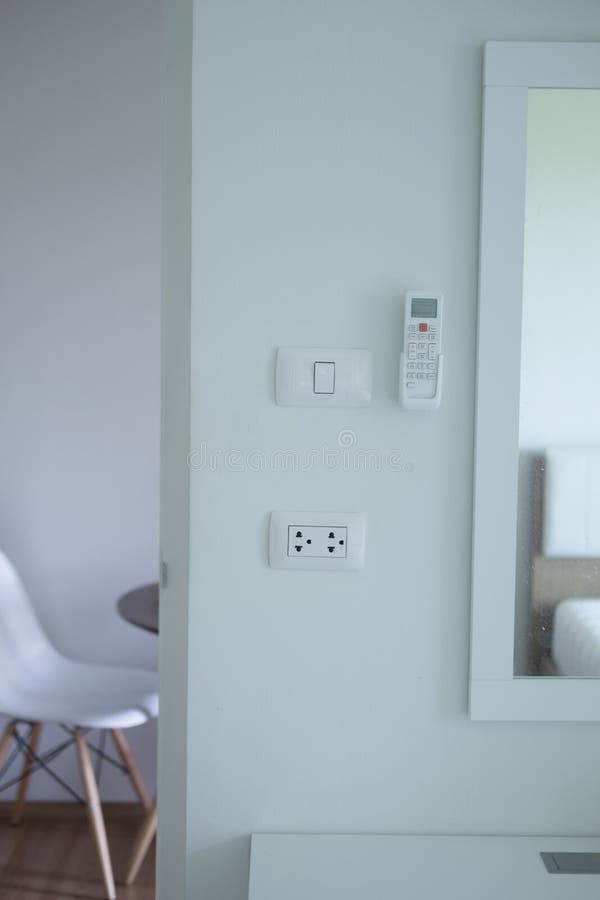 Electric Switch and Air Conditioner Remote Stock Photo Image of