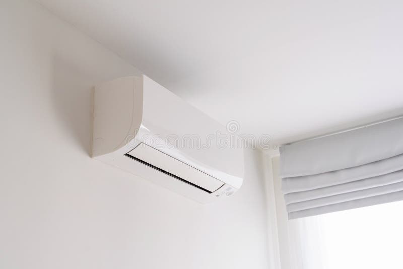 Air Conditioner on White Concrete Wall in Area of Bedroom Stock Image