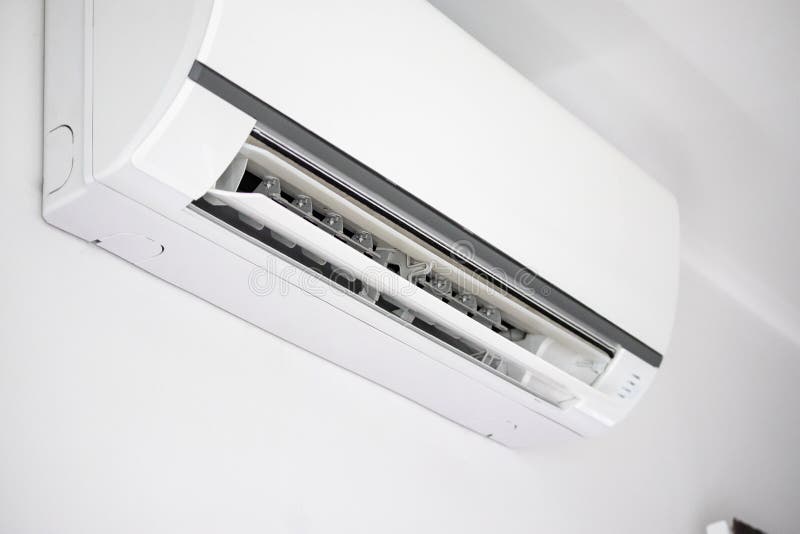 Air Conditioner on White Wall Room Interior Background Stock Image