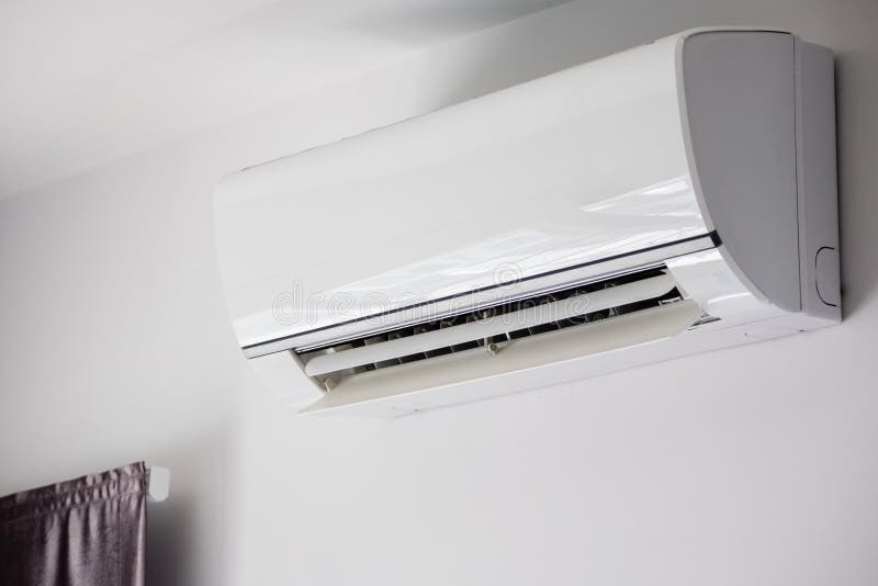 Air Conditioner on White Wall Room Interior Background Stock Image