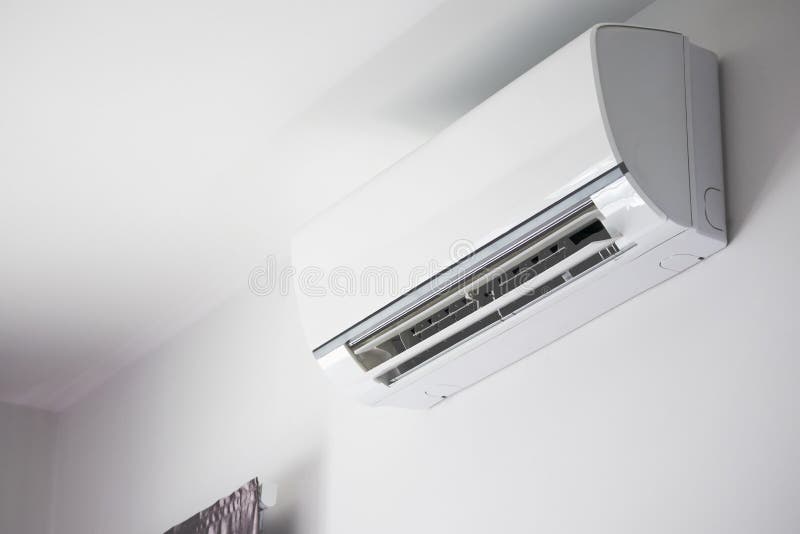 Air Conditioner on White Wall Room Interior Background Stock Image
