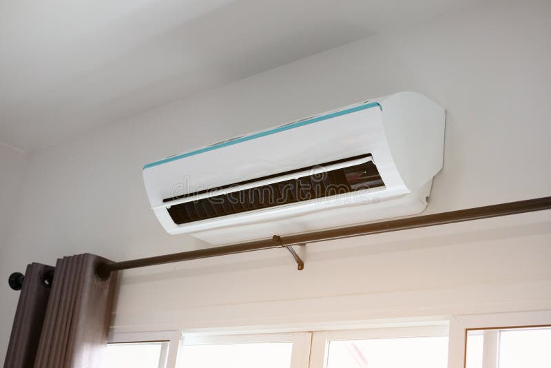 Air Conditioner on White Wall Room Interior Background Stock Image
