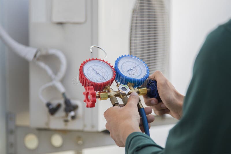 Air Conditioning, HVAC Service Technician Using Gauges To Check