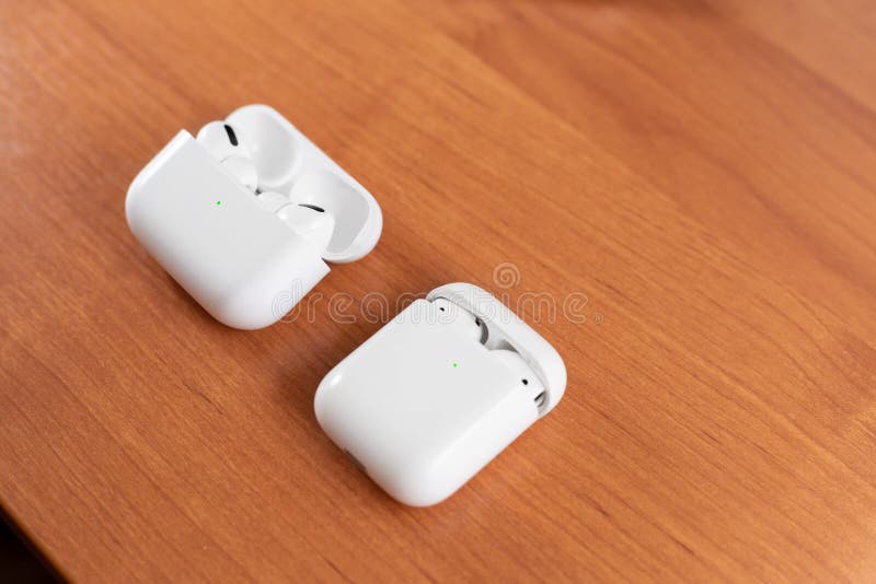 Air Pods Pro. with Wireless Charging Case. New Airpods pro on wooden background. Air pods. Copy space