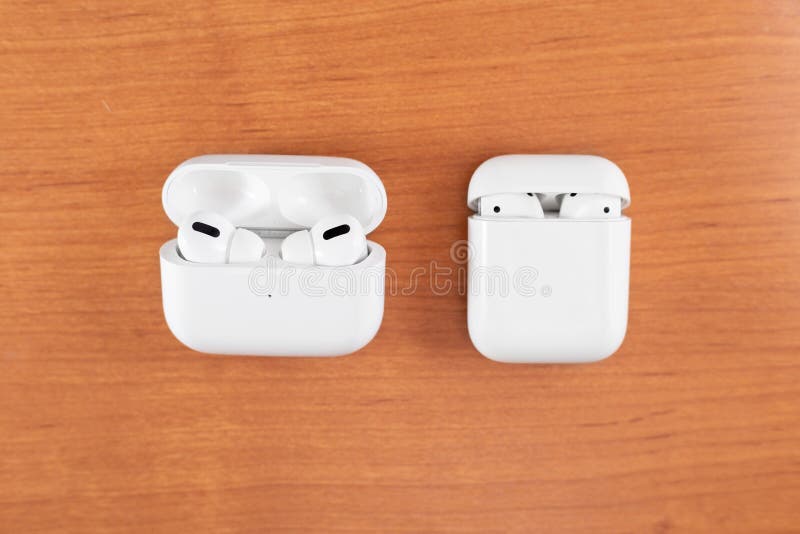 Air Pods Pro. with Wireless Charging Case. New Airpods pro on wooden background. Air pods. Copy space. Air Pods Pro. with Wireless Charging Case. New Airpods pro on wooden background. Air pods. Copy space.