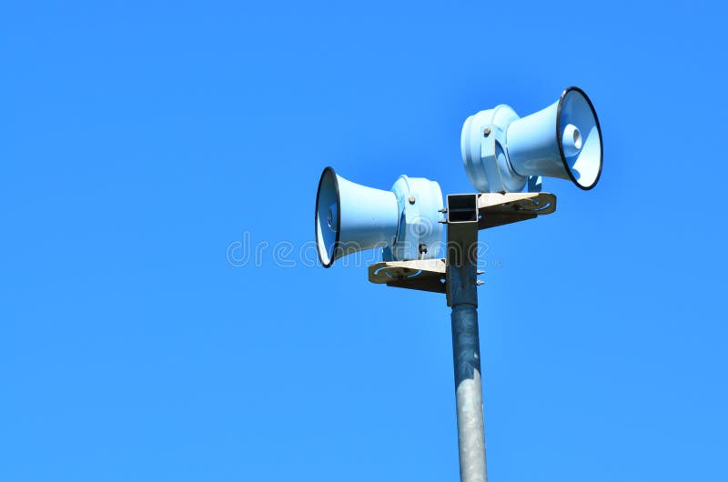 Air raid siren against blue sky