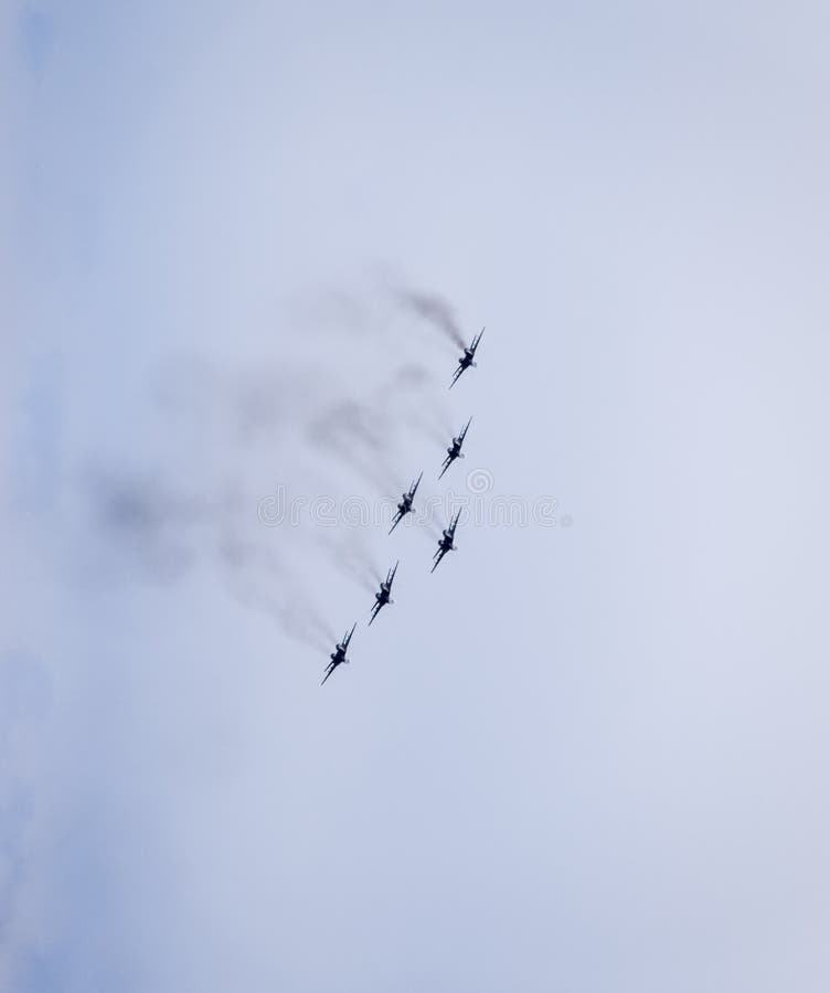 Air show in the sky above the Krasnodar airport flight school. Airshow in honor of Defender of the Fatherland. MiG-29 in the sky