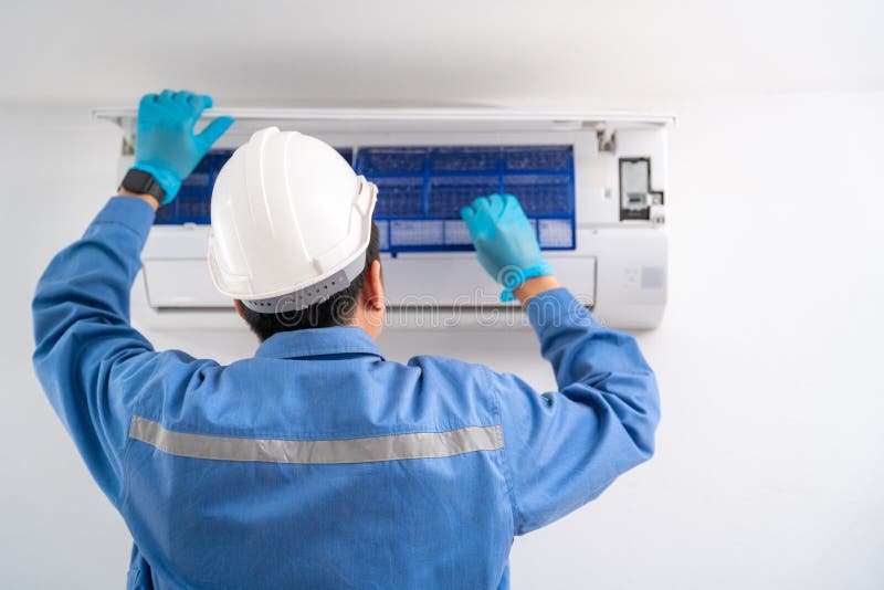 Air Technician Service Cleaning Air Conditioner Indoors. Service