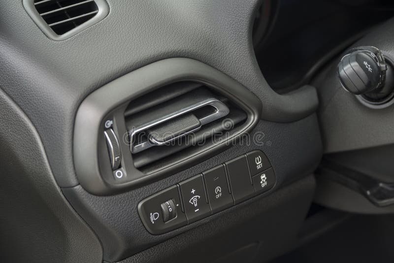 Air Vent Grill in a Car. Air Conditioner Grid and Control Panel Buttons