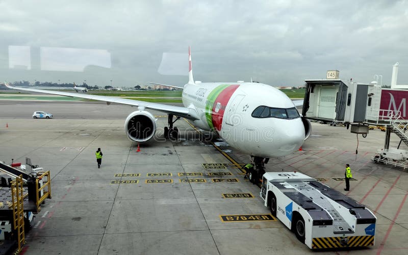 Airbus A330-900neo, D. Maria II, of TAP Air Portugal, at the boarding bridge of Lisbon International Airport, Lisbon, Portugal - November 26, 2023. Airbus A330-900neo, D. Maria II, of TAP Air Portugal, at the boarding bridge of Lisbon International Airport, Lisbon, Portugal - November 26, 2023