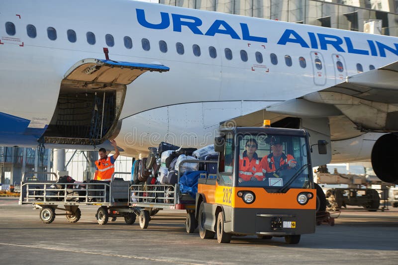 Aircraft of the Aeroflot Airbus VQ-BST during loading and unloading operations, preparing for the flight at the parking lot of royalty free stock image