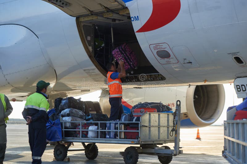 Aircraft of the Aeroflot Airbus VQ-BST during loading and unloading operations, preparing for the flight at the parking lot of royalty free stock photo