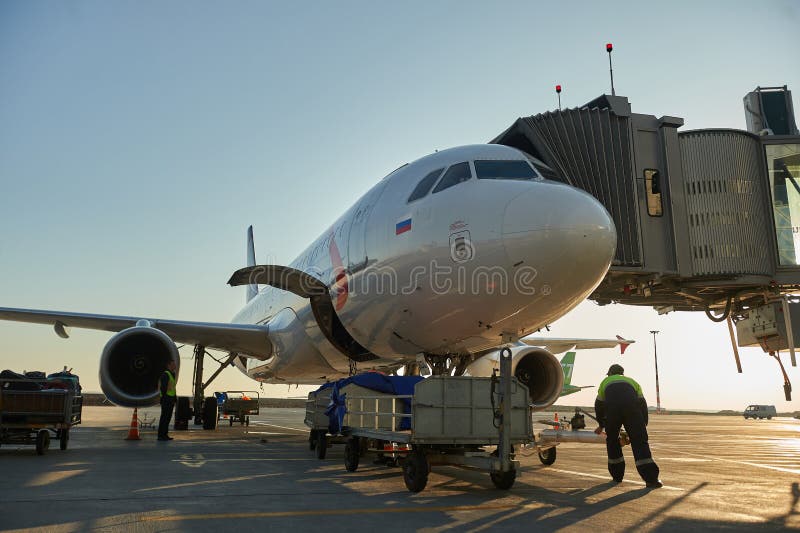 Aircraft of the Aeroflot Airbus VQ-BST during loading and unloading operations, preparing for the flight at the parking lot of royalty free stock photography