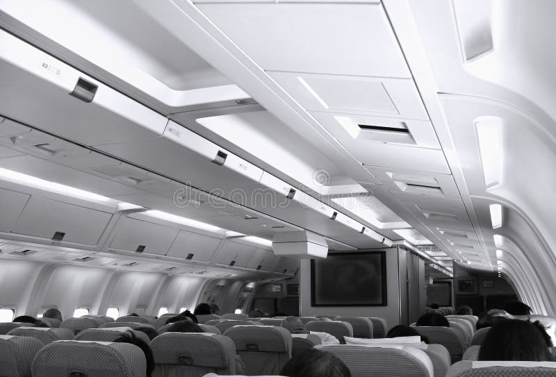 The interior view of the passenger cabin of a civilian airliner. The interior view of the passenger cabin of a civilian airliner