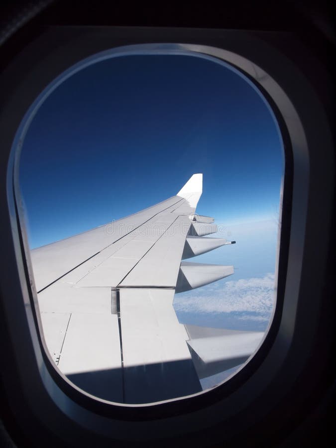 Aircraft window & wing. stock photo. Image of speed, flying - 16202720