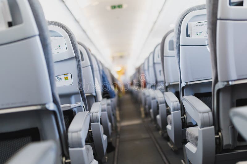 Airline passenger seats and aisle in airplane