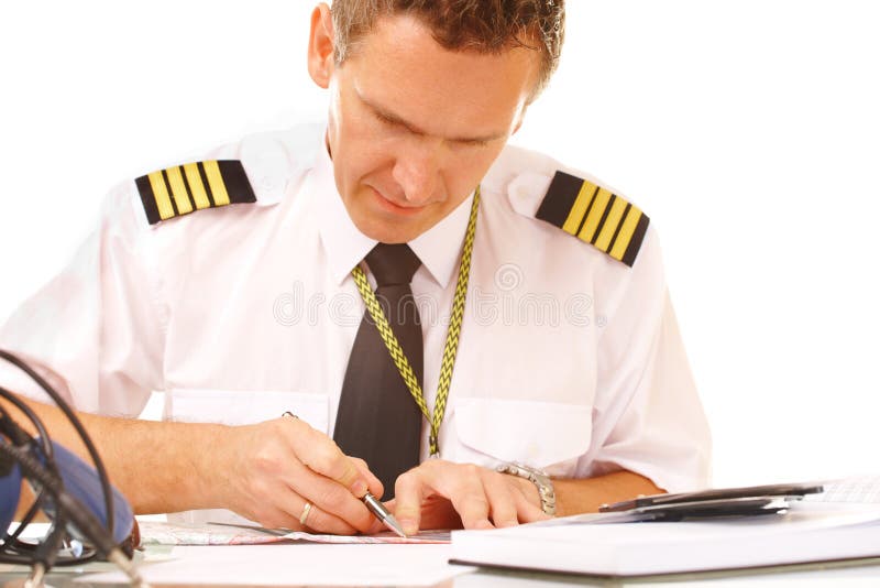Airline pilot filling in papers stock photo