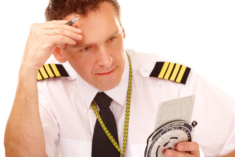 Airline pilot using flight computer royalty free stock images