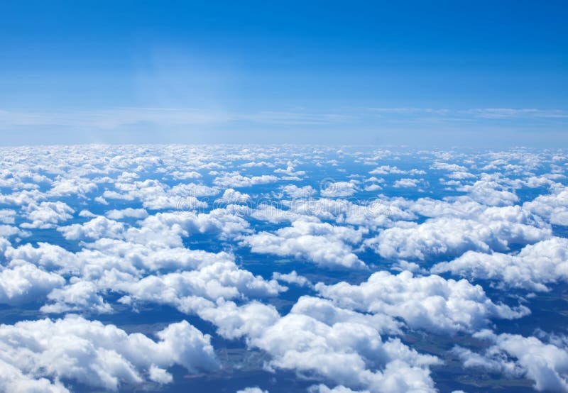 Airplain Window Seat View of Big White Thick Fluffy Clouds with Stock ...