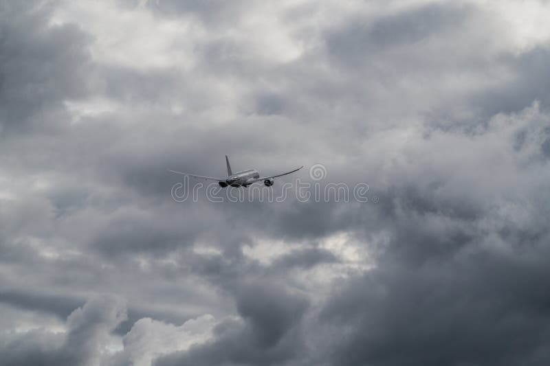 The airplane is ascending in the bad weather