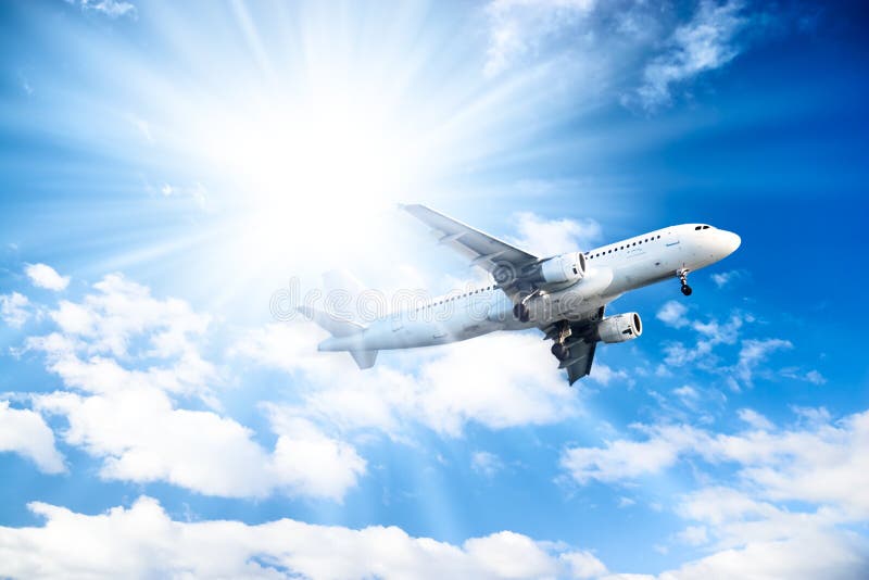 Airplane On Blue Sky And Bright Sun Background Stock Image Image of