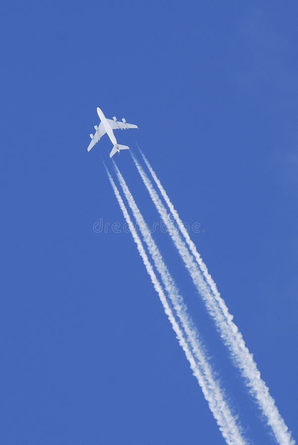 Airplane flying in blue sky royalty free stock photography