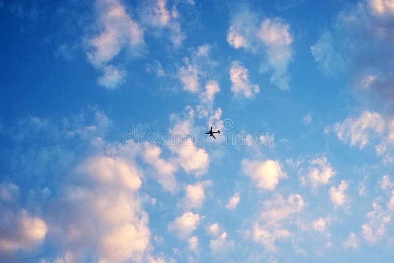 Airplane flying in clouds sky royalty free stock images