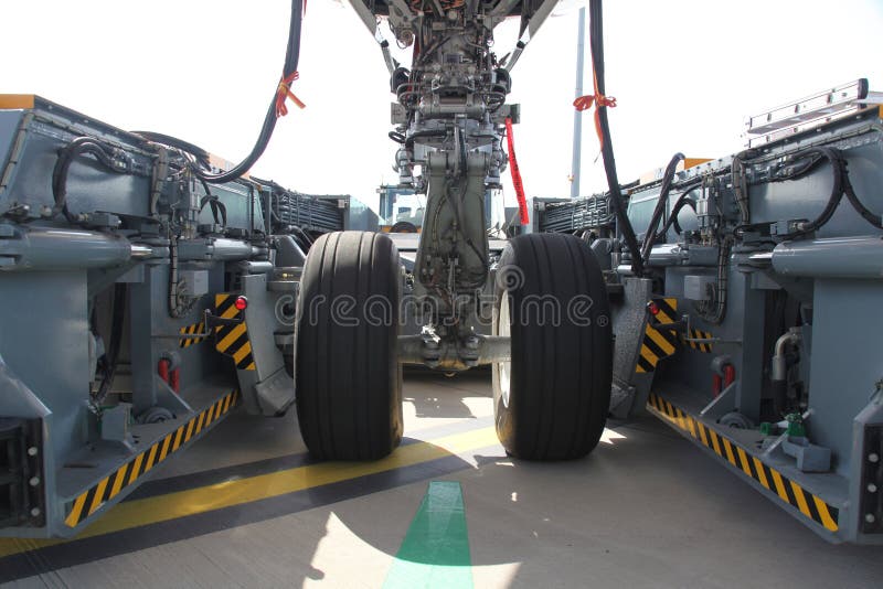 Airplane gear in pull car stock image. Image of ground 10016267