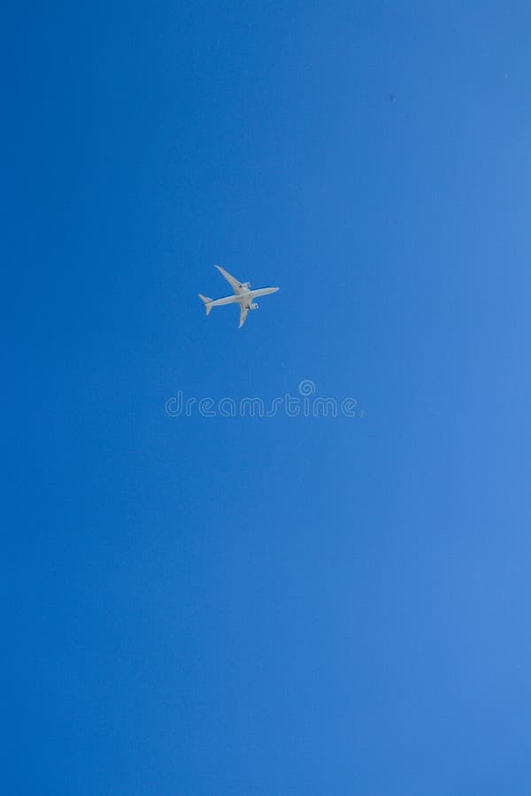 Airplane High In Blue Sky Bright Blue Sky With A Flight Stock Photo Airplane High In Blue Sky Bright Blue Sky With A Flight Stock Photo