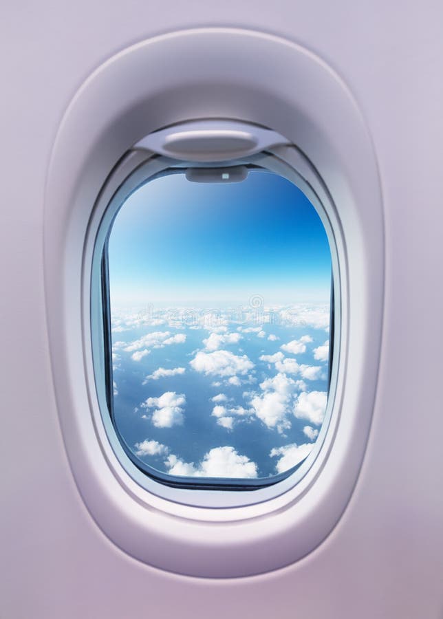 Airplane interior with window view of clouds