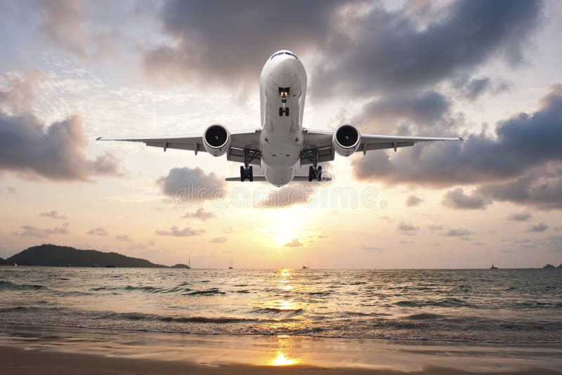 Airplane Landing in sunset stock image. Image of touching - 67914349