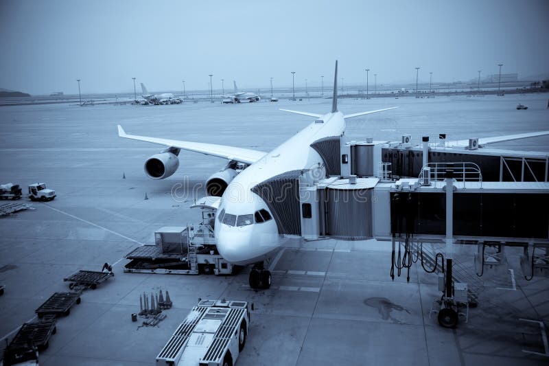 Airplane Loading At The Airport