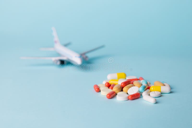 Airplane Model with Multicolored Pills from Motion Sickness Scattered