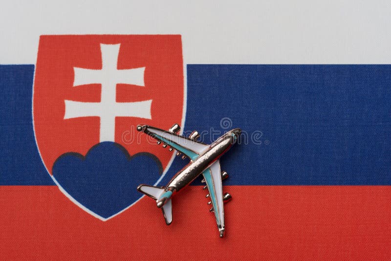 Airplane over the flag of Slovakia, the concept of travel royalty free stock photography Airplane over the flag of Slovakia, the concept of travel royalty free stock photography