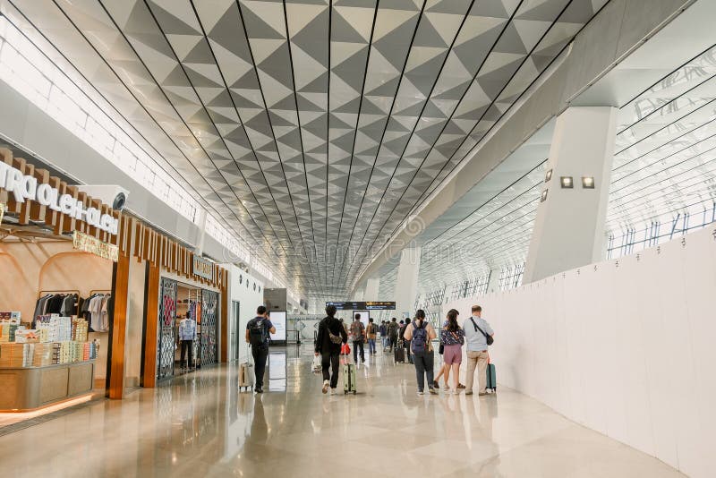 Airplane passengers are walking through Terminal 3 of Soekarno-Hatta Airport to get to the gates. Airplane passengers are walking through Terminal 3 of Soekarno-Hatta Airport to get to the gates.