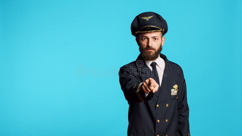 Airplane Pilot in Uniform Pointing at Camera Stock Photo - Image of ...