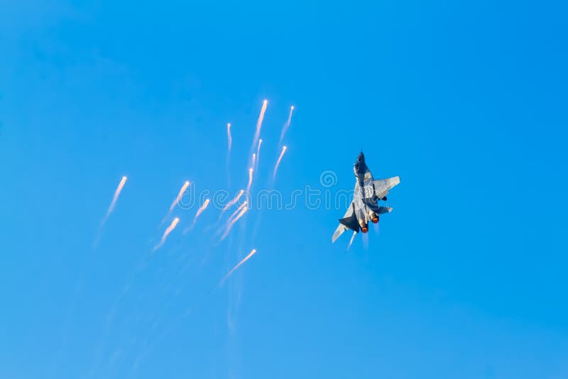 Airplane releases flares on the airshow