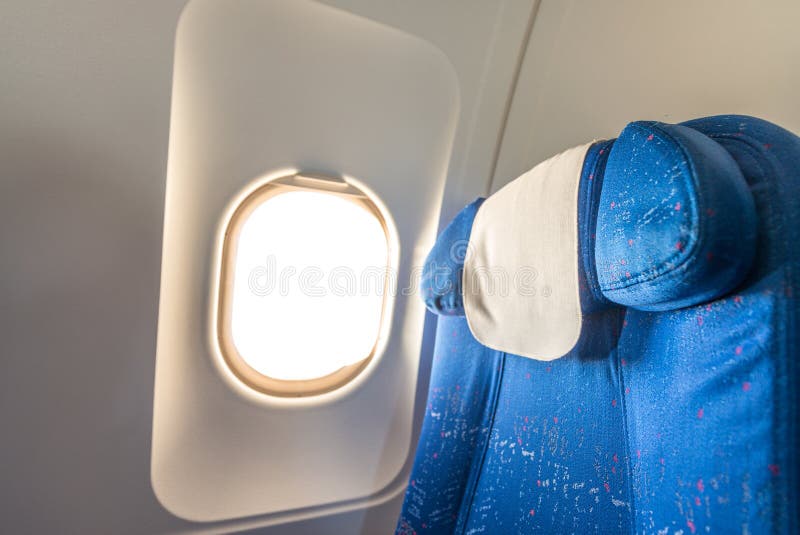 Airplane seat with white empty window stock photos Airplane seat with white empty window stock photos