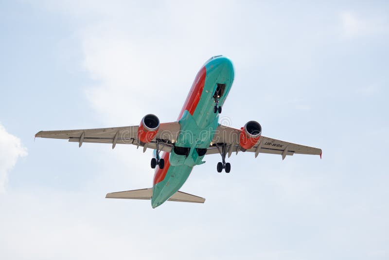 Airplane taking off with clouds in the blue sky